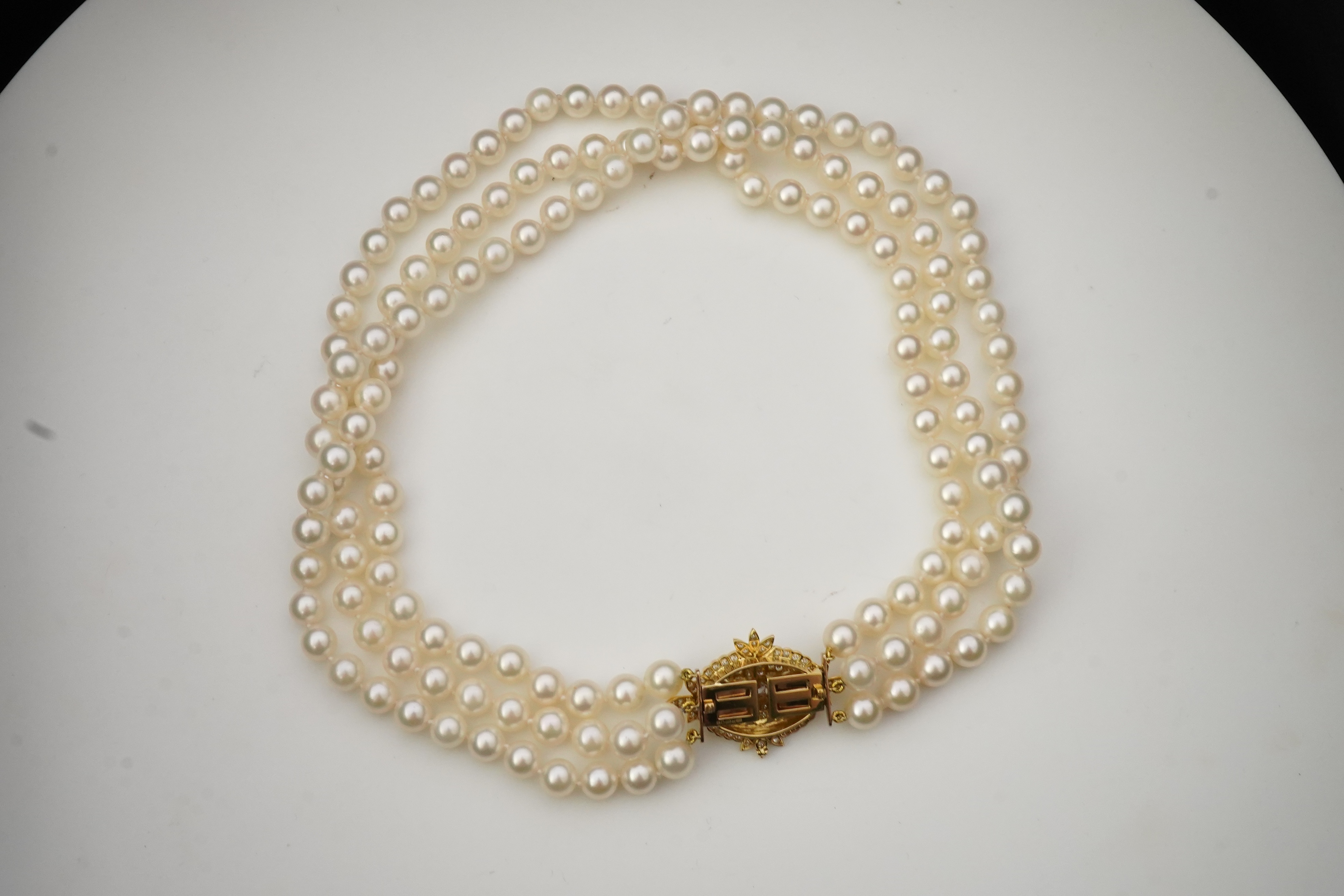 A cultured pearl and diamond necklace/brooch